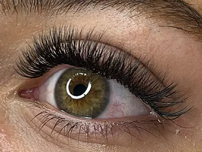 Dramatic Volume 5D-7D eyelash extensions enhancing natural lashes.