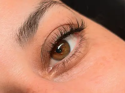 An elegant display of a Classic Full Set of individual eyelash extensions enhancing natural beauty.